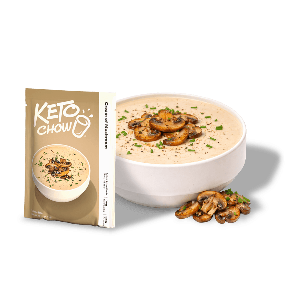 KETO chow Cream of Mushroom soup base beige pouch next to a white bowl of soup garnished with sautéed mushrooms and chives. Pouch says Ultra Low-Carb Single Meal.