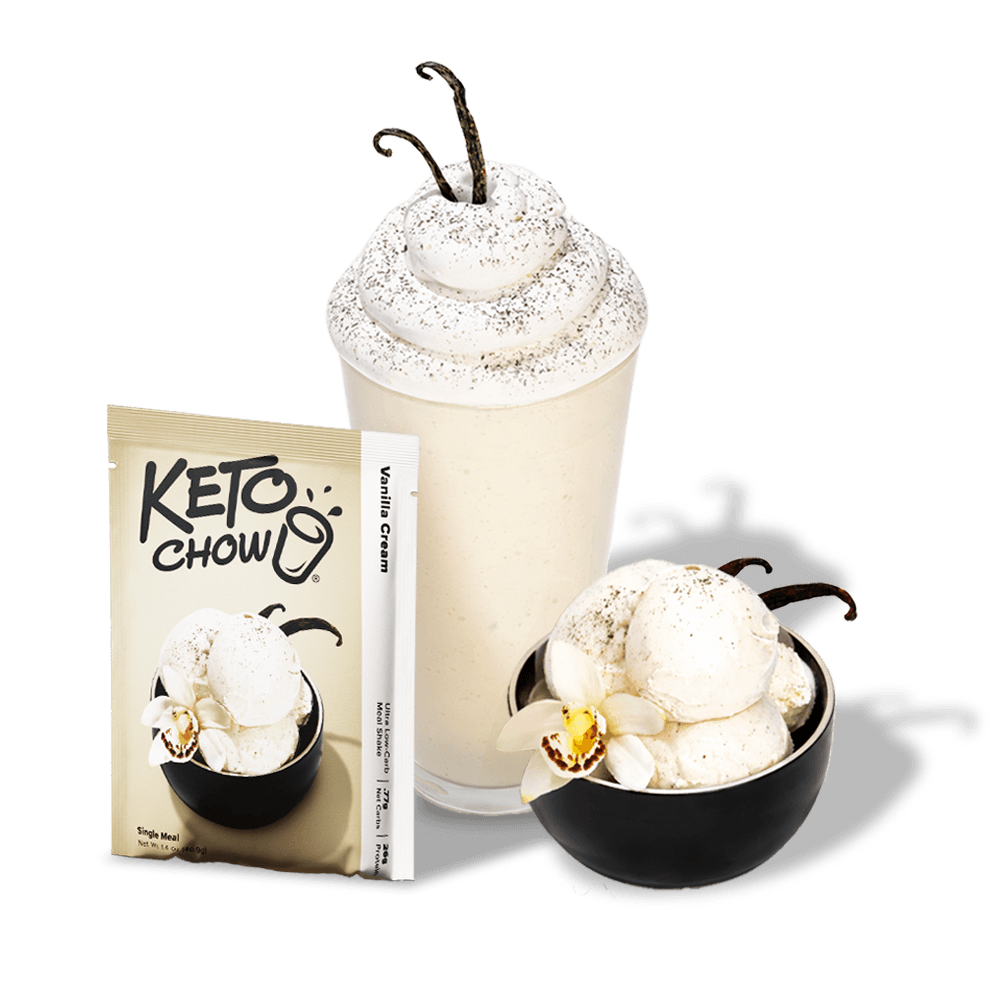 KETO CHOW Vanilla Cream sachet, beige with black logo and text. Beside it, a vanilla shake and scoops, garnished with vanilla beans and orchids.